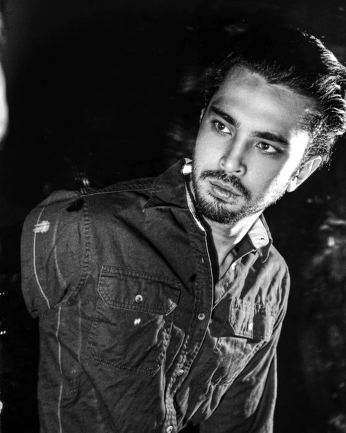 Black and white editorial portrait of Alex Wiltz, Editor and Animator. STOCK PLACEHOLDER - swap with real team portrait.
