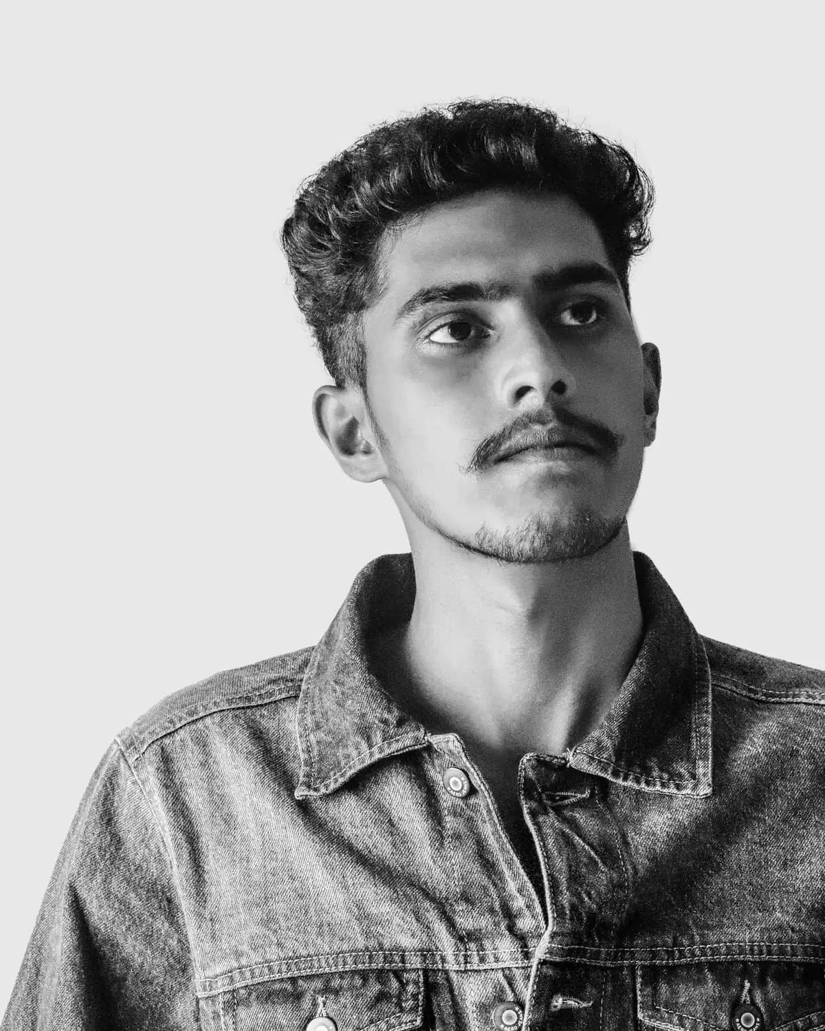 Black and white editorial portrait of Dex Williams, Video Director. STOCK PLACEHOLDER - swap with real team portrait.