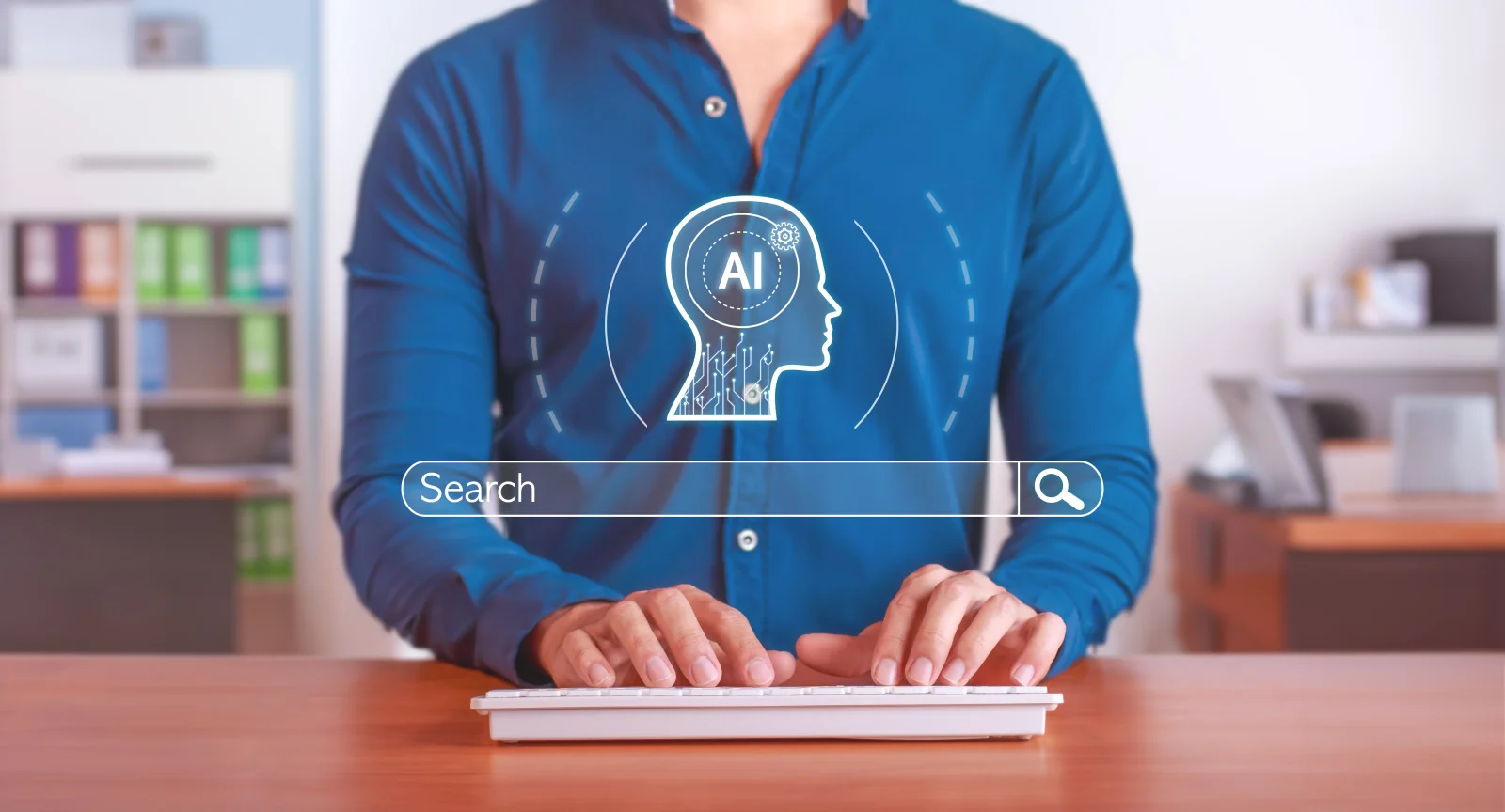 Person typing at a keyboard beneath a glowing search bar and an AI head icon in an office